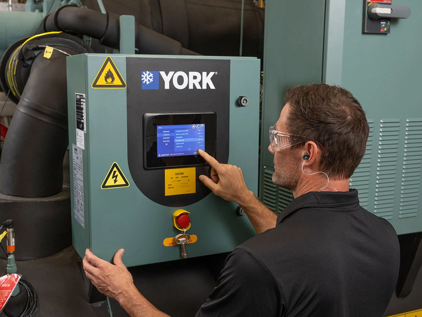 A male worker operating the installed chiller