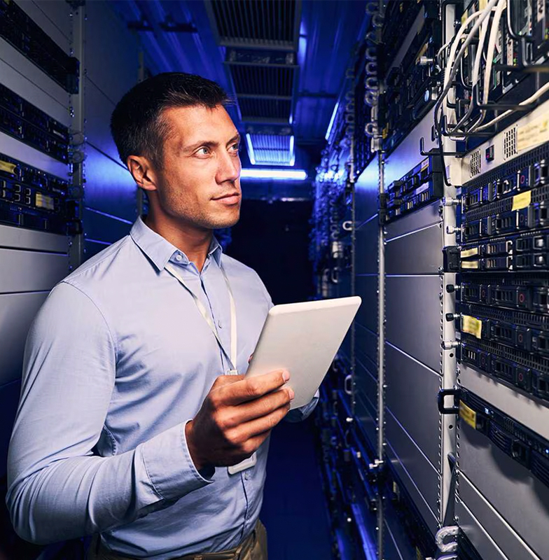Employee holding a tablet in a server room