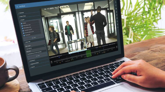 Close-up of a person's at the laptop displaying the cctv footages